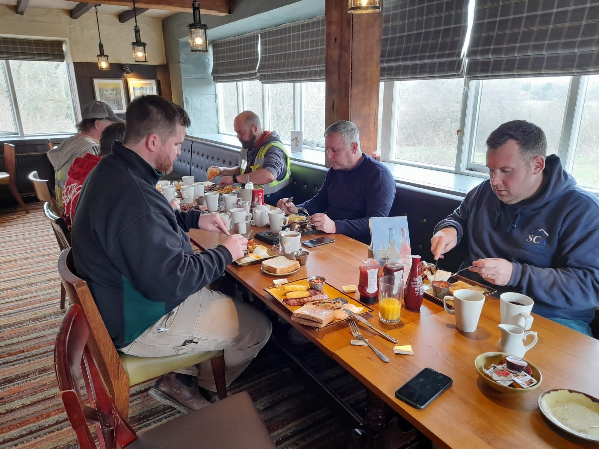 Members of the SC4 Team enjoy a cooked breakfast courtesy of Taylor Lane Timber Frame Ltd